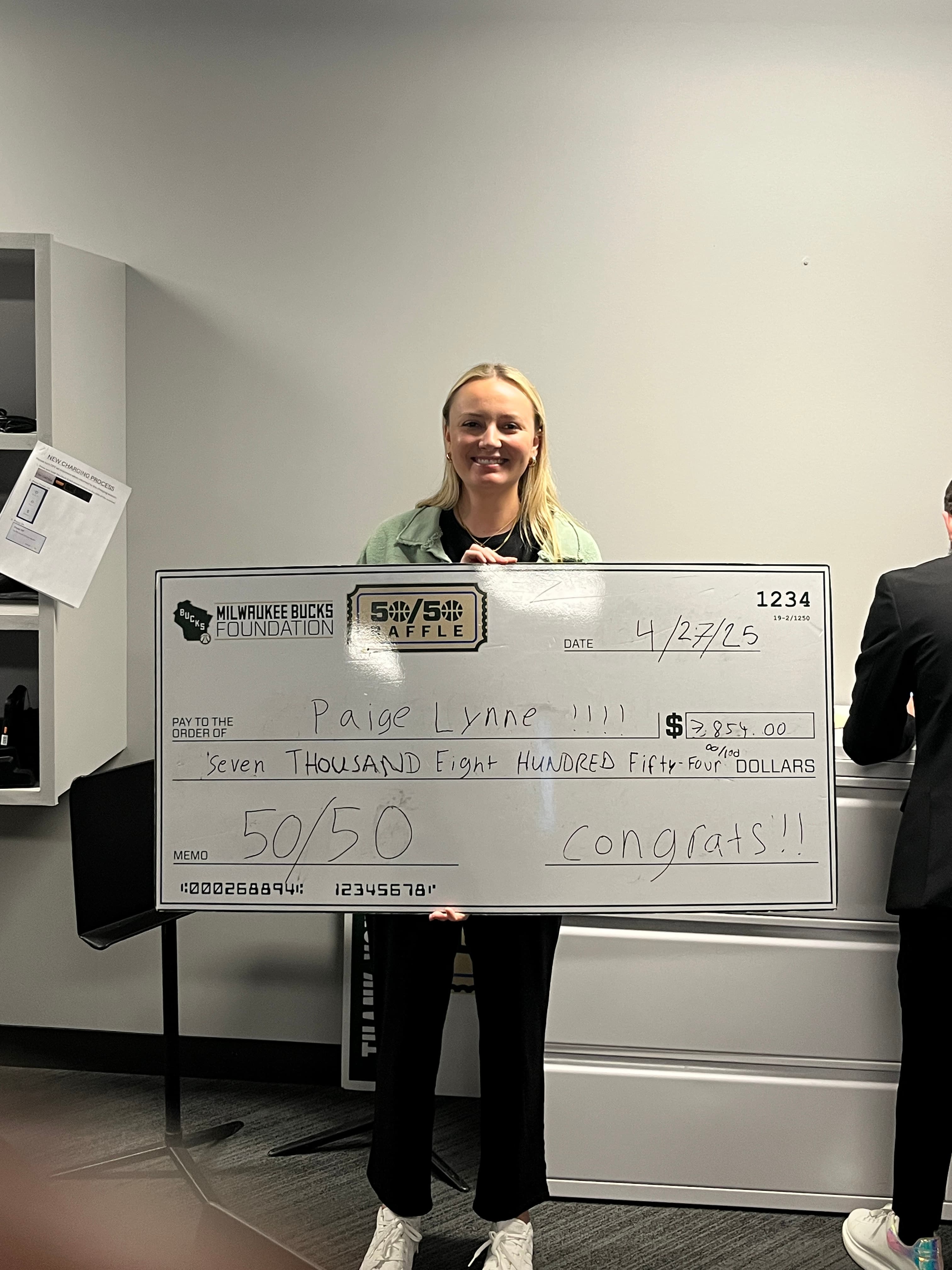 Milwaukee Bucks fan & 50/50 raffle winner